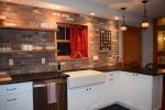Kitchen with exposed brick wall